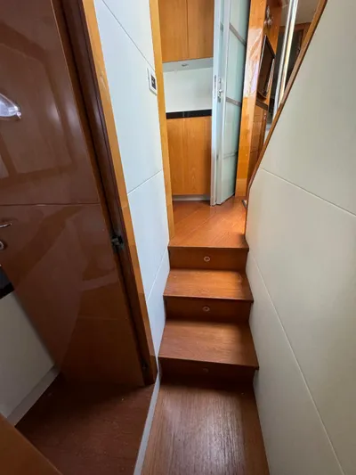  Yacht Photos Pics Interior of 2006 Pershing 56 yacht with wooden stairs and modern design.