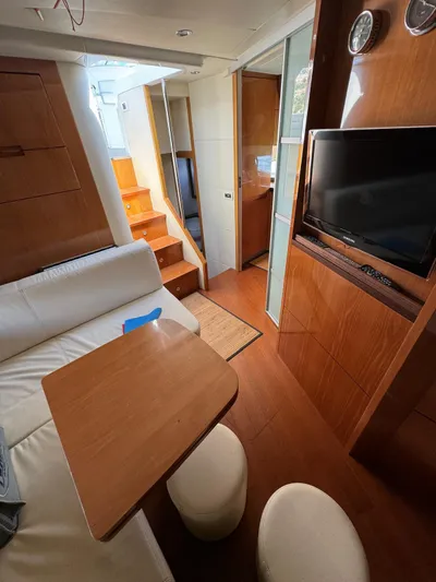  Yacht Photos Pics Interior of a 2006 Pershing 56 yacht with wooden finishes and modern amenities.