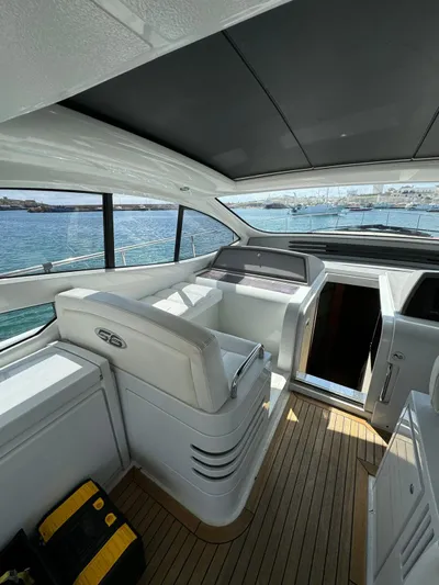  Yacht Photos Pics Interior view of a 2006 Pershing 56 yacht with sleek design and wooden flooring.