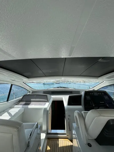  Yacht Photos Pics Interior view of a 2006 Pershing 56 yacht cockpit with modern controls.