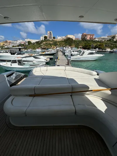  Yacht Photos Pics Luxurious 2006 Pershing 56 yacht docked in a scenic marina.