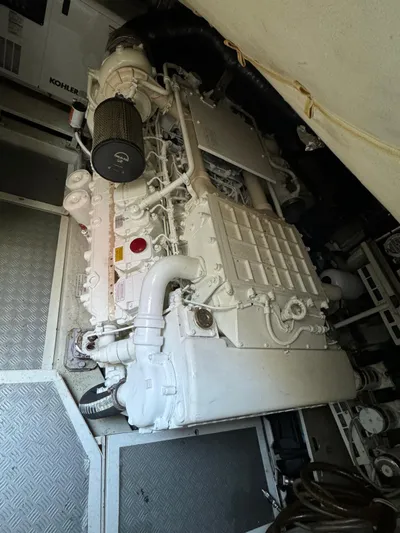  Yacht Photos Pics Engine room of a 2006 Pershing 56 yacht, featuring a Kohler generator.