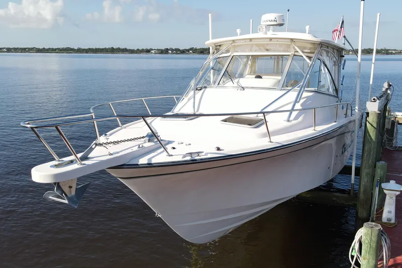 Kristy Lynn Yacht Photos Pics 2010 Grady-White Express 330 boat docked on calm water.