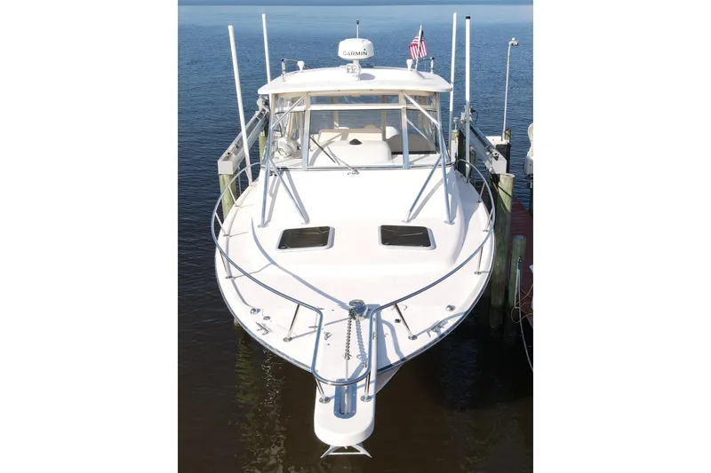 Kristy Lynn Yacht Photos Pics 2010 Grady-White Express 330 boat docked, front view, with American flag.