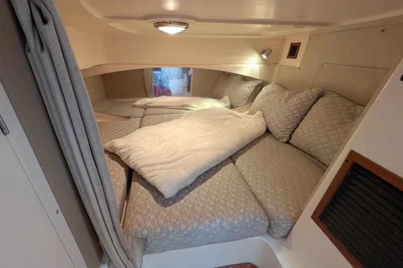 Kristy Lynn Yacht Photos Pics 2010 Grady-White Express 330 cabin interior with cozy bedding and cushions.
