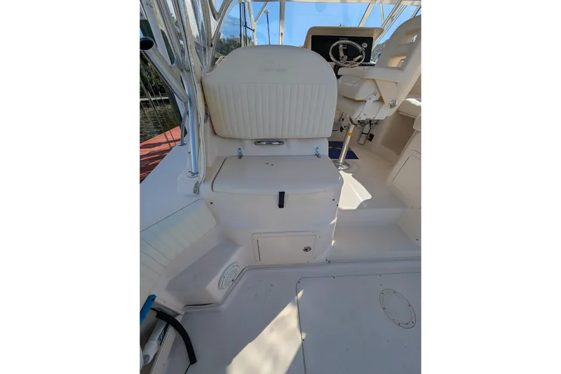 Kristy Lynn Yacht Photos Pics 2010 Grady-White Express 330 boat interior with seating and steering wheel.