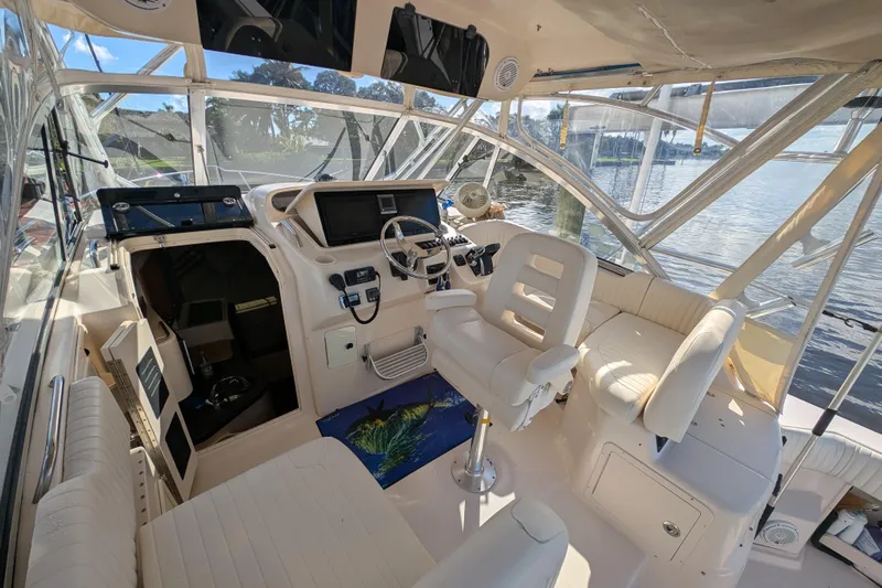 Kristy Lynn Yacht Photos Pics 2010 Grady-White Express 330 boat interior with helm, seating, and water view.