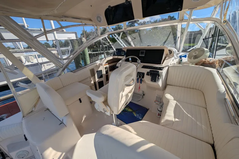 Kristy Lynn Yacht Photos Pics 2010 Grady-White Express 330 boat interior with helm, seating, and controls.