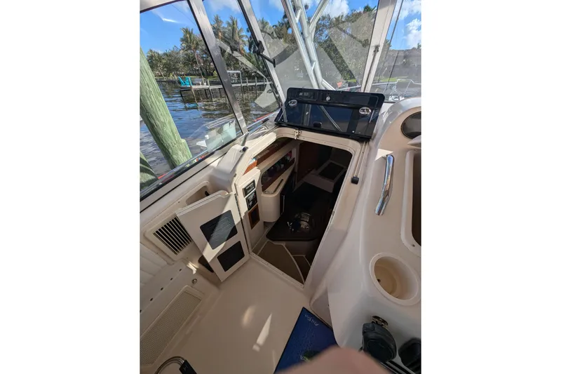 Kristy Lynn Yacht Photos Pics 2010 Grady-White Express 330 boat interior with open cabin door, dockside view.