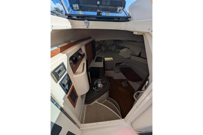 Kristy Lynn Yacht Photos Pics 2010 Grady-White Express 330 cabin interior with seating and control panels.