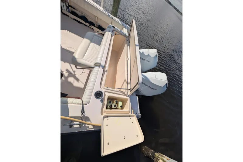 Kristy Lynn Yacht Photos Pics 2010 Grady-White Express 330 boat with open storage compartment and twin Mercury engines.