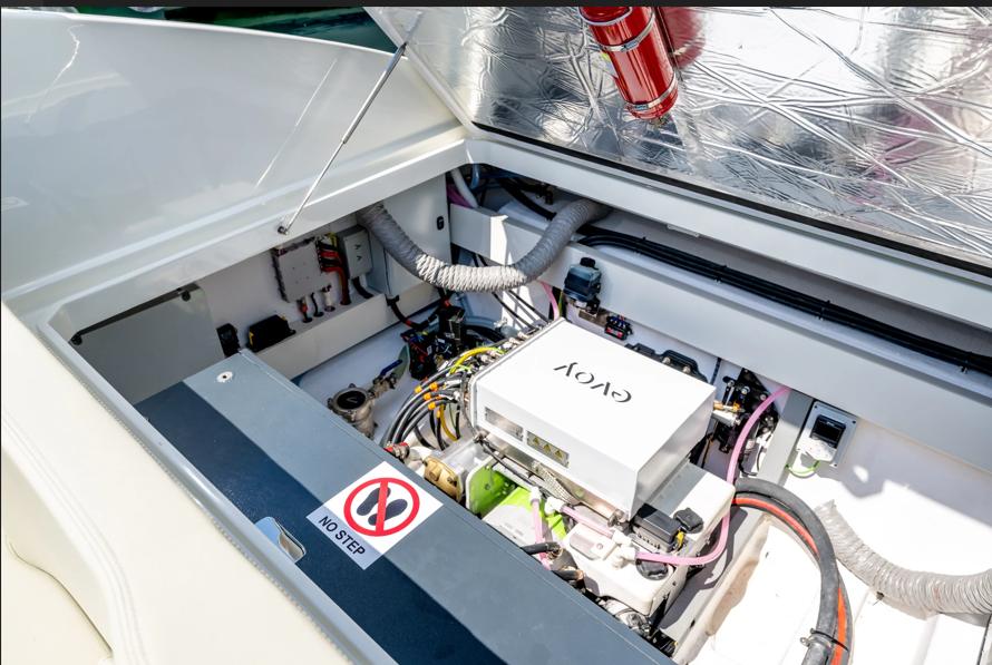 Engine compartment of 2023 Performance e801 boat, featuring advanced components and safety equipment.