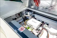 Engine compartment of 2023 Performance e801 boat, featuring advanced components and safety equipment.