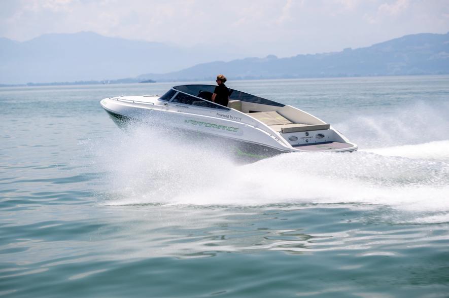 2023 Performance e801 speedboat cruising on open water, creating a dynamic wake.