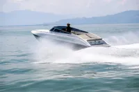 2023 Performance e801 speedboat cruising on open water, creating a dynamic wake.