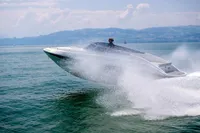 2023 Performance e801 speedboat skimming across water, creating a dynamic splash.