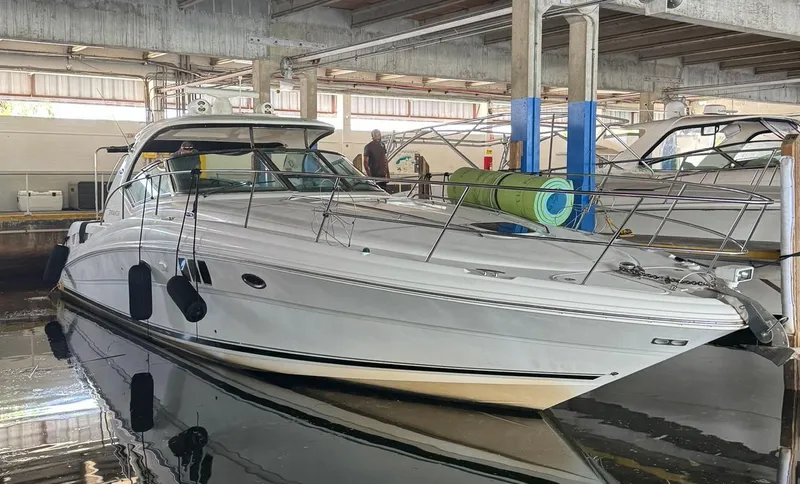  Yacht Photos Pics 2007 Sea Ray 44 Sundancer yacht docked in a marina.