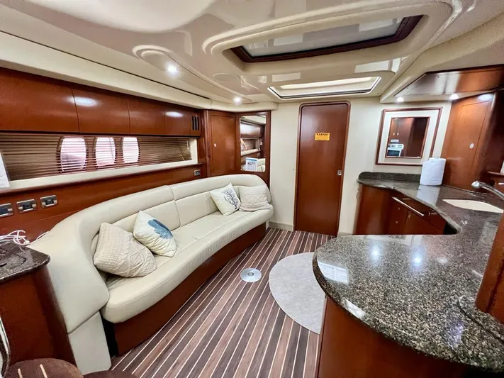  Yacht Photos Pics Luxurious interior of 2007 Sea Ray 44 Sundancer yacht with elegant seating and modern design.