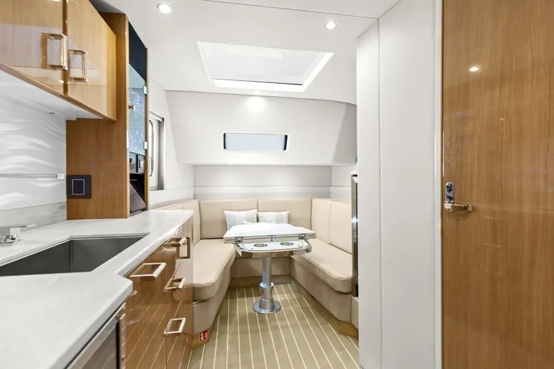  Yacht Photos Pics 2025 Formula 500 Super Sport Crossover interior with modern kitchen and cozy seating area.