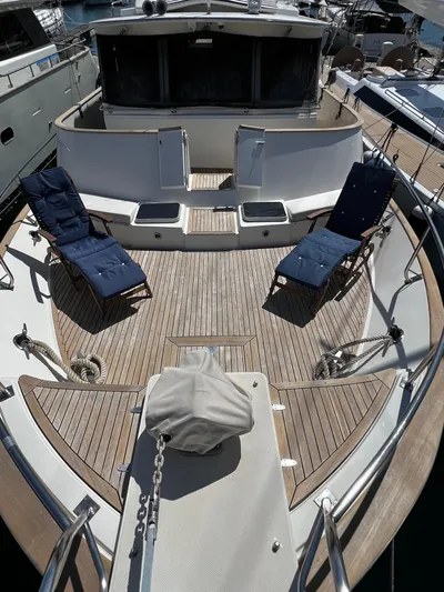  Yacht Photos Pics 1996 Fleming 55 yacht deck with lounge chairs and wooden flooring.