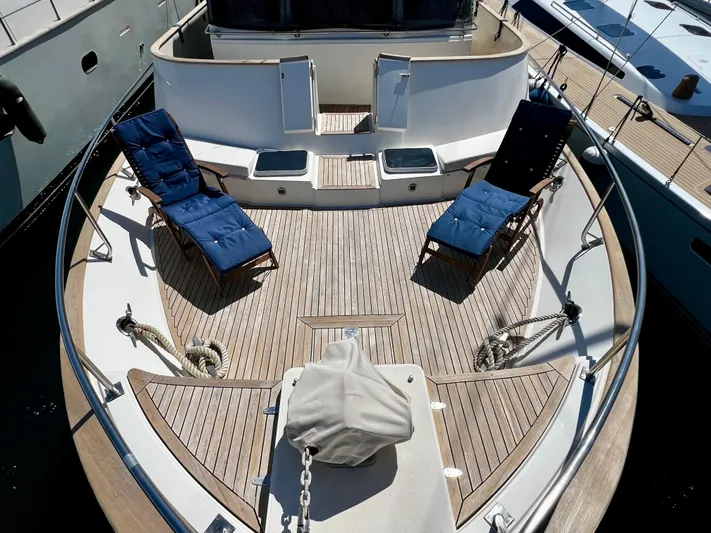  Yacht Photos Pics Deck of 1996 Fleming 55 yacht with lounge chairs and wooden flooring.