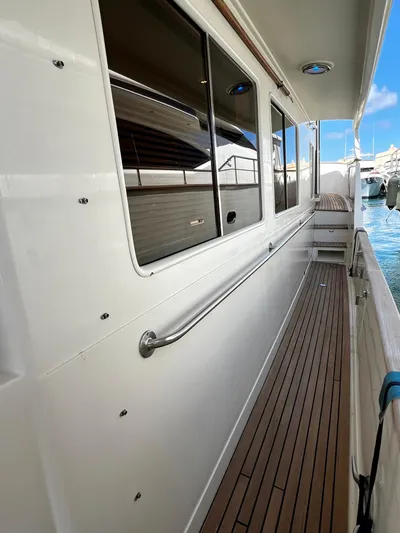  Yacht Photos Pics Side deck of a 1996 Fleming 55 yacht with teak flooring and railing.