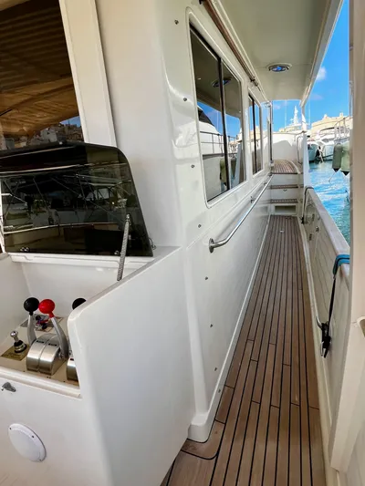  Yacht Photos Pics Side deck of 1996 Fleming 55 yacht with teak flooring and control panel.