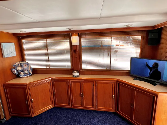  Yacht Photos Pics Interior of 1996 Fleming 55 yacht with wooden cabinets and a TV.
