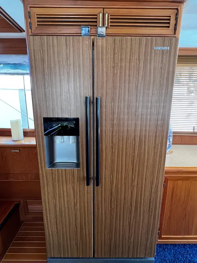  Yacht Photos Pics Wood-paneled Samsung refrigerator with water dispenser on a 1996 Fleming 55 yacht.
