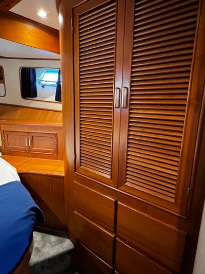  Yacht Photos Pics Wooden interior of a 1996 Fleming 55 yacht cabin with storage cabinets.