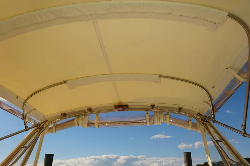 Narwhal Yacht Photos Pics 2007 Hunt Yachts Surfhunter 29 canopy with clear sky background.