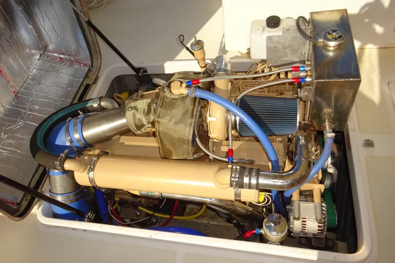 Narwhal Yacht Photos Pics Engine compartment of 2007 Hunt Yachts Surfhunter 29, showcasing detailed mechanical components.