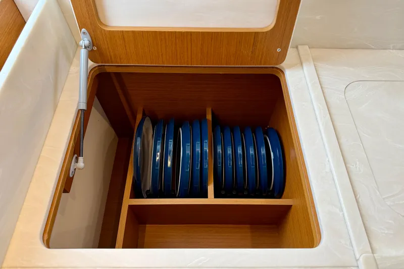  Yacht Photos Pics Storage compartment with blue plates in 2026 Beneteau Swift Trawler 41 Fly.
