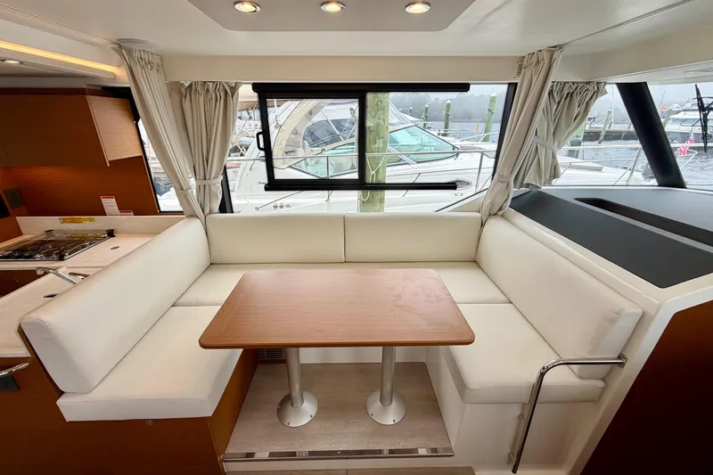  Yacht Photos Pics Interior of 2026 Beneteau Swift Trawler 41 Fly with elegant dining area.