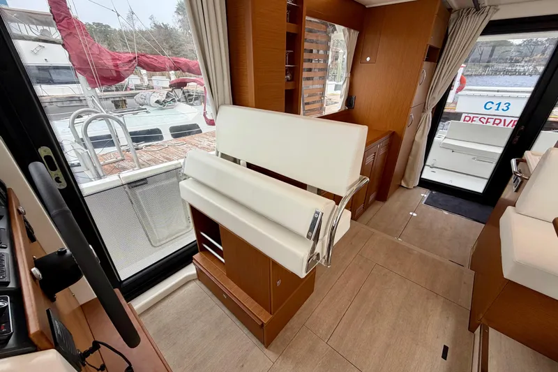  Yacht Photos Pics Interior of 2026 Beneteau Swift Trawler 41 Fly, featuring modern seating and wood finishes.