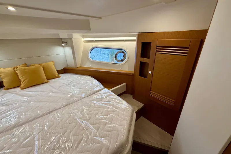  Yacht Photos Pics Luxurious cabin interior of 2026 Beneteau Swift Trawler 41 Fly with cozy bedding.