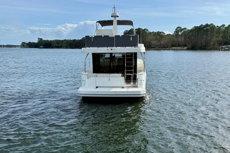  Yacht Photos Pics 2026 Beneteau Swift Trawler 41 Fly on serene lake waters.
