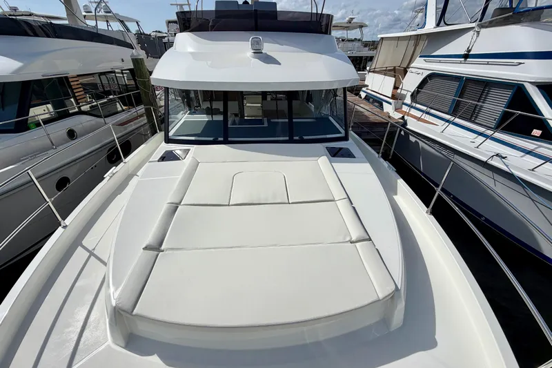  Yacht Photos Pics 2026 Beneteau Swift Trawler 41 Fly, docked, showcasing spacious deck and sleek design.