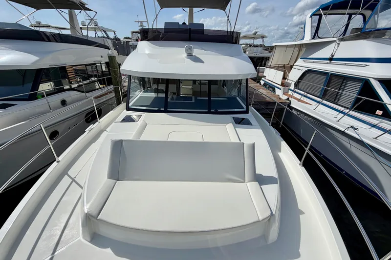  Yacht Photos Pics 2026 Beneteau Swift Trawler 41 Fly, docked, showcasing sleek design and spacious deck.