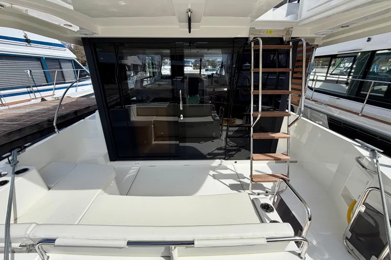  Yacht Photos Pics 2026 Beneteau Swift Trawler 41 Fly, rear deck view with seating and ladder.