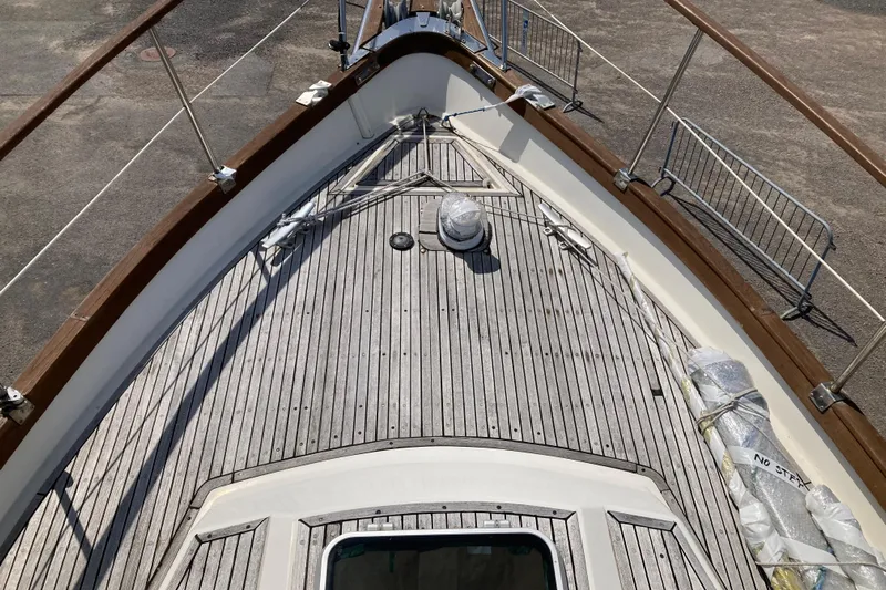 Latte Yacht Photos Pics Deck of 1987 Nauticat 38 sailboat with wooden railings and fittings.