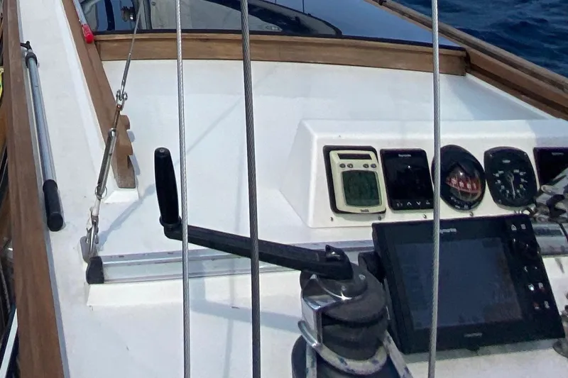 Latte Yacht Photos Pics Cockpit of 1987 Nauticat 38 sailboat with navigation instruments and controls.