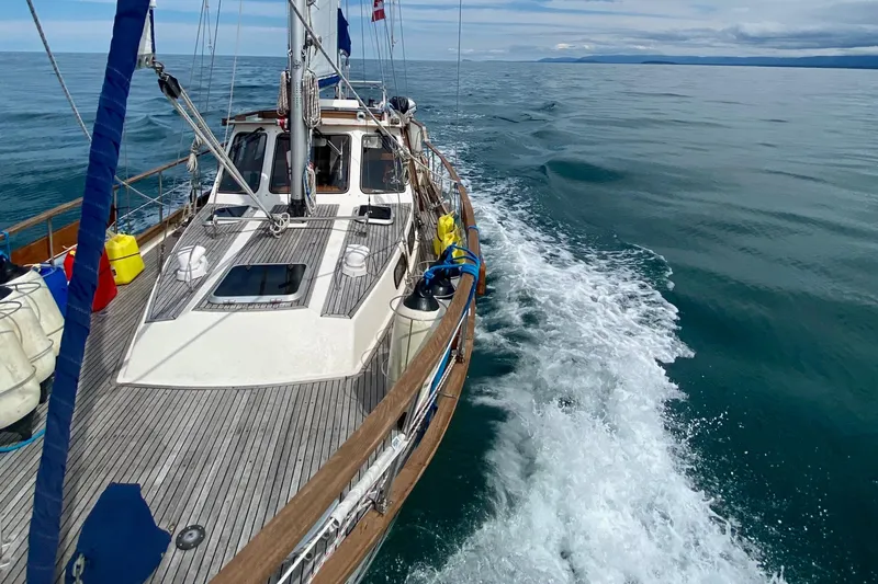 Latte Yacht Photos Pics Sailing on a 1987 Nauticat 38 yacht, cruising through calm ocean waters.