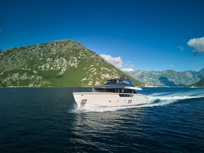  Yacht Photos Pics Sanlorenzo SX88 yacht cruising near scenic mountains, 2020 model.