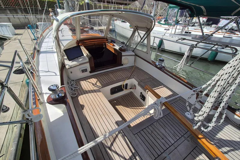 Pearl Yacht Photos Pics 1996 Cape George 36 sailboat cockpit with wooden deck and nautical equipment.