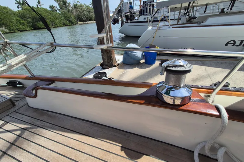 Pearl Yacht Photos Pics Sailboat deck of a 1996 Cape George 36, featuring a winch and wooden trim.