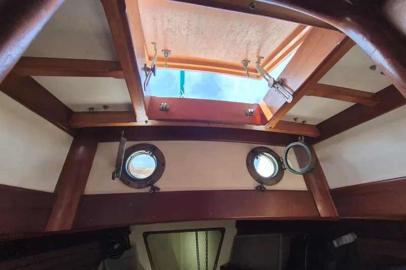 Pearl Yacht Photos Pics Interior view of 1996 Cape George 36 sailboat with open hatch and portholes.