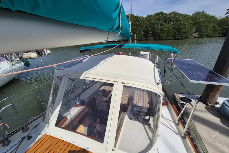 Pearl Yacht Photos Pics Cape George 36 sailboat, 1996 model, docked with solar panel and turquoise canopy.