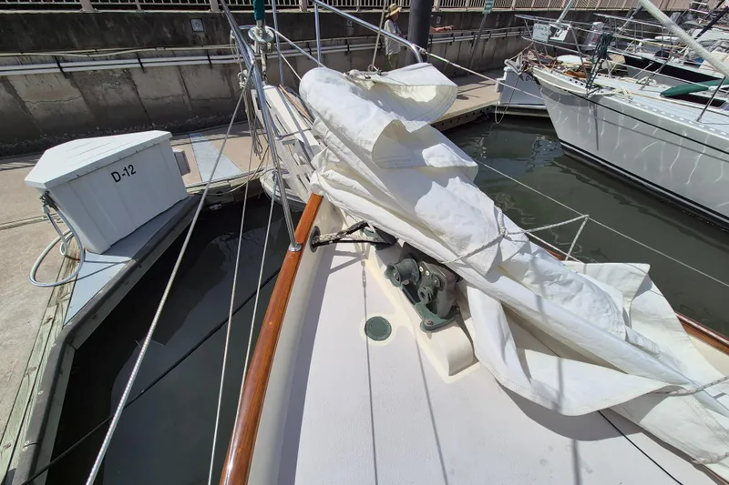 Pearl Yacht Photos Pics 1996 Cape George 36 sailboat docked, with sails neatly folded on deck.
