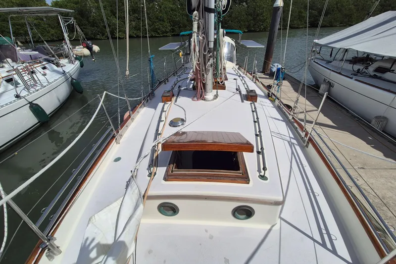 Pearl Yacht Photos Pics Sailboat deck view of 1996 Cape George 36, docked with surrounding boats.